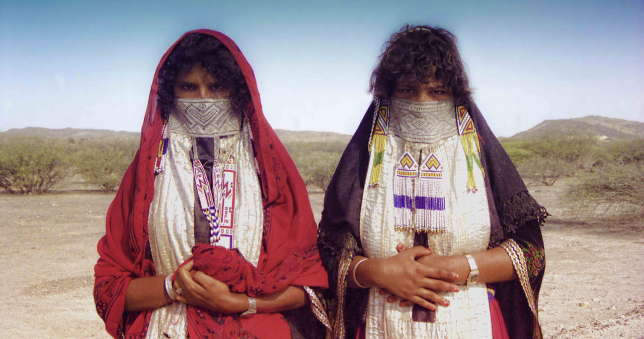 Young women in colorful festival dresses